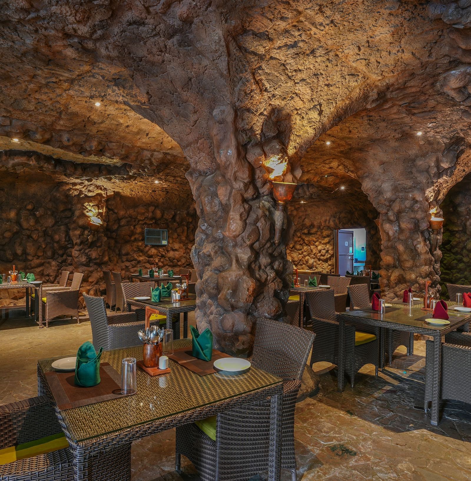 Kholong restaurant with a rock-themed décor, warm lighting, all tables, seating, and culinary arrangements arranged aesthetically2