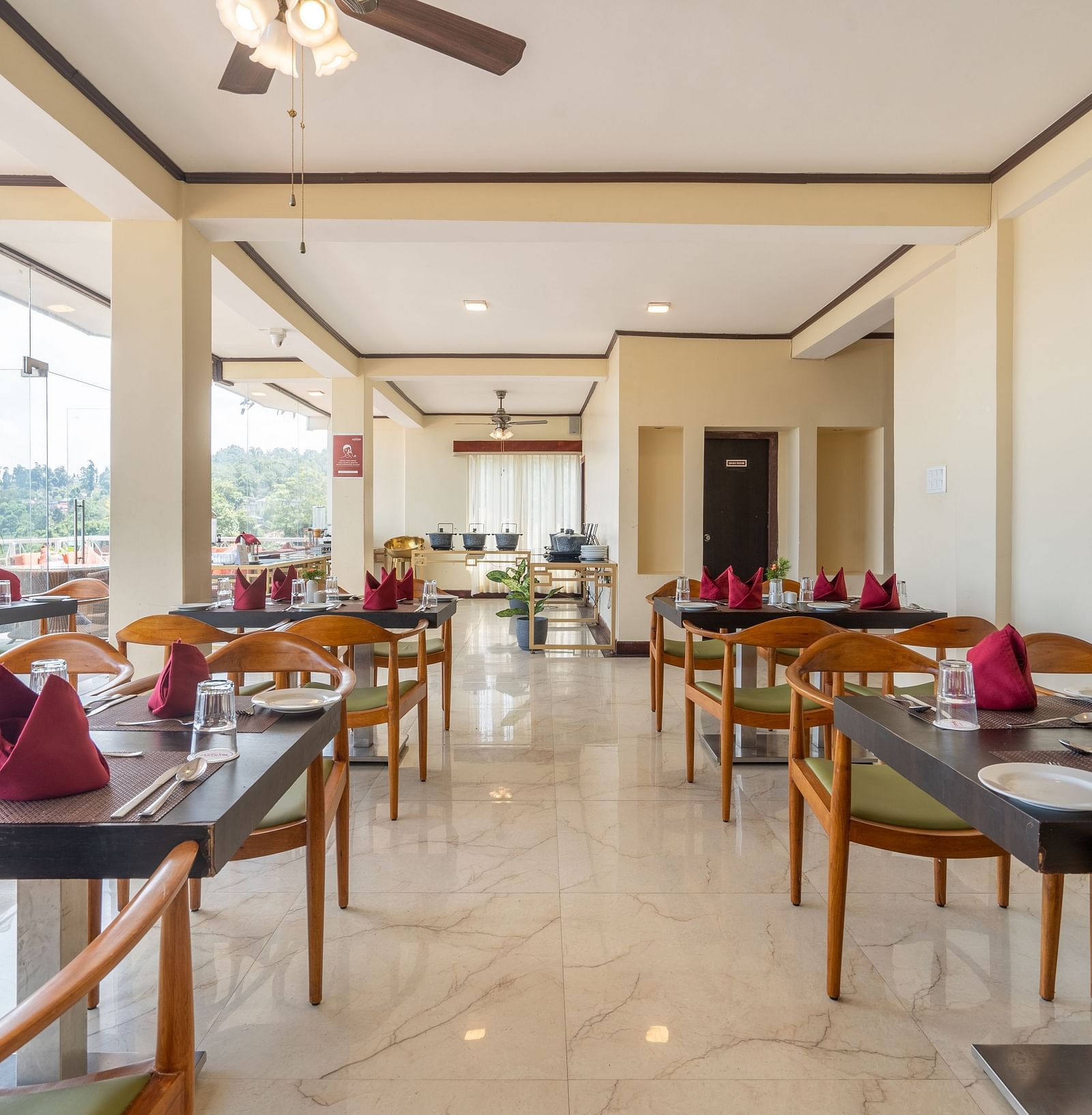 dining setting in a restaurant at Summit Lillium Hotel & Spa, Kalimpong
