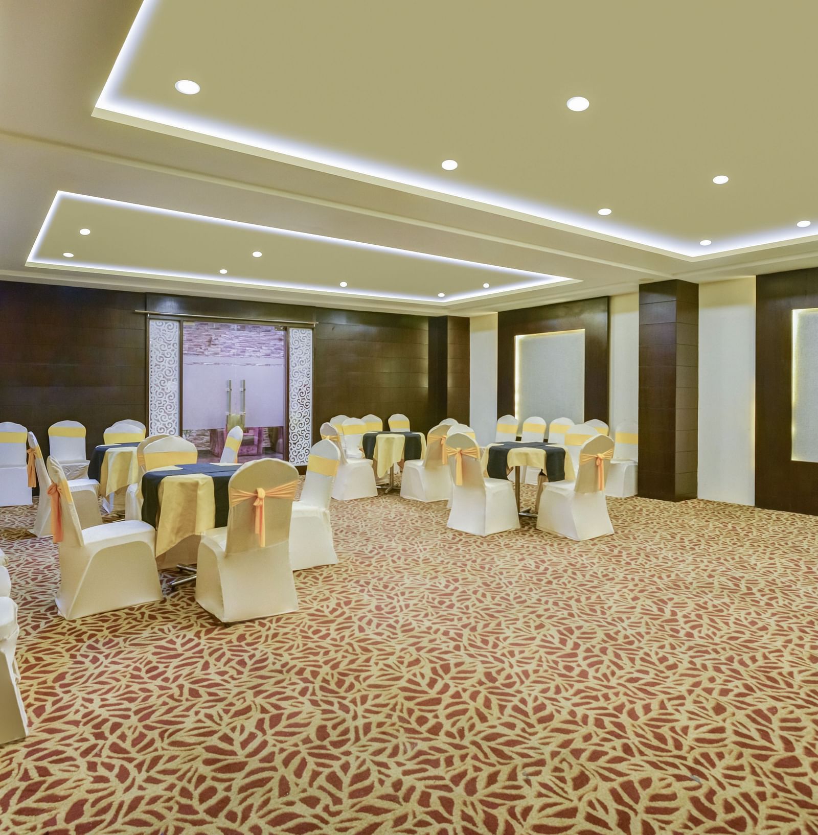 Banquet area with chairs arranged and decorated for the celebration