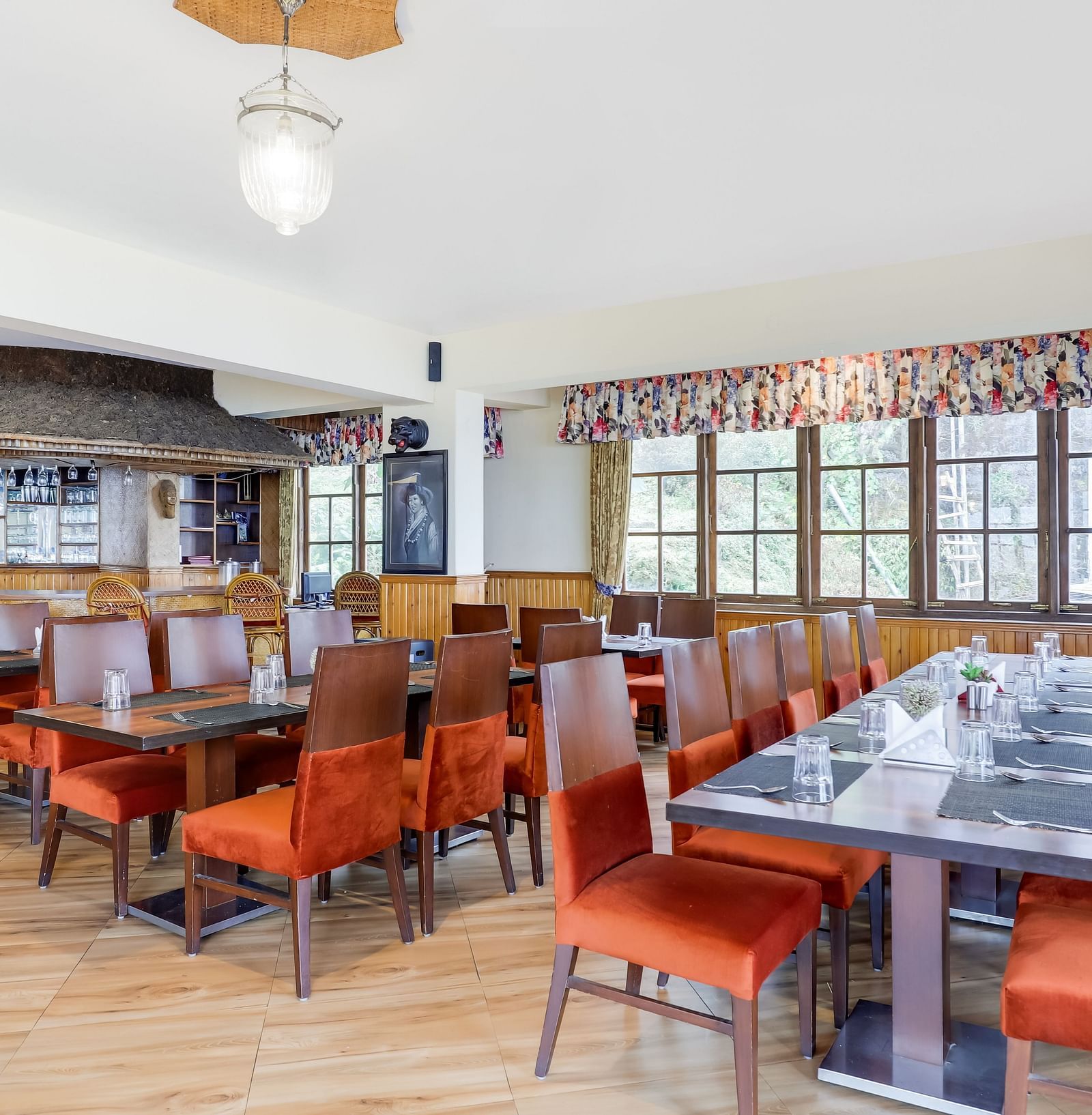 Multiple dining tables and chairs placed in a closed hall | Summit Newa Regency & Spa, Pelling