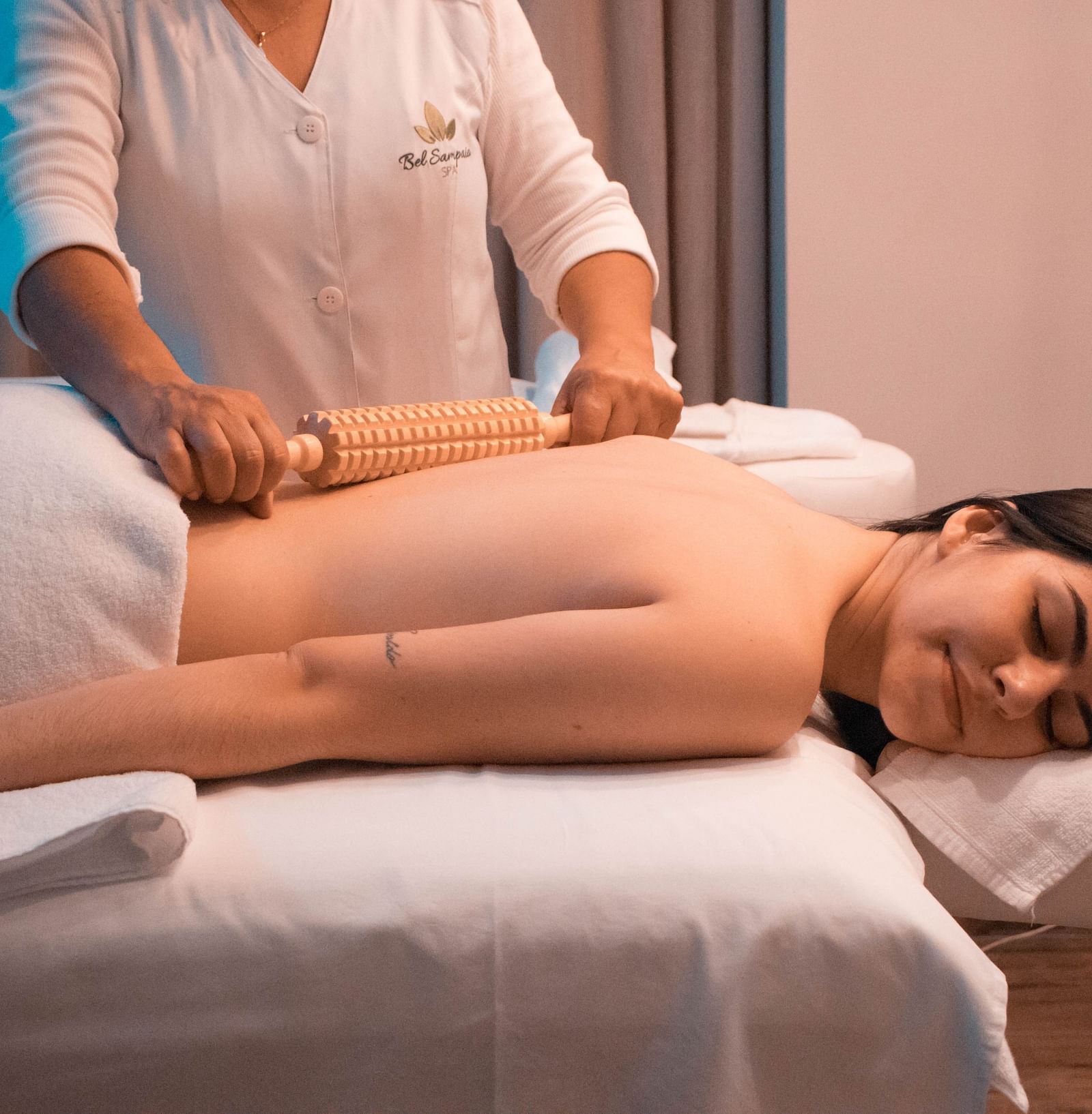 A person lying upside down on a spa bed and getting massaged | Summit Oakden Resort & Spa, Mall Road