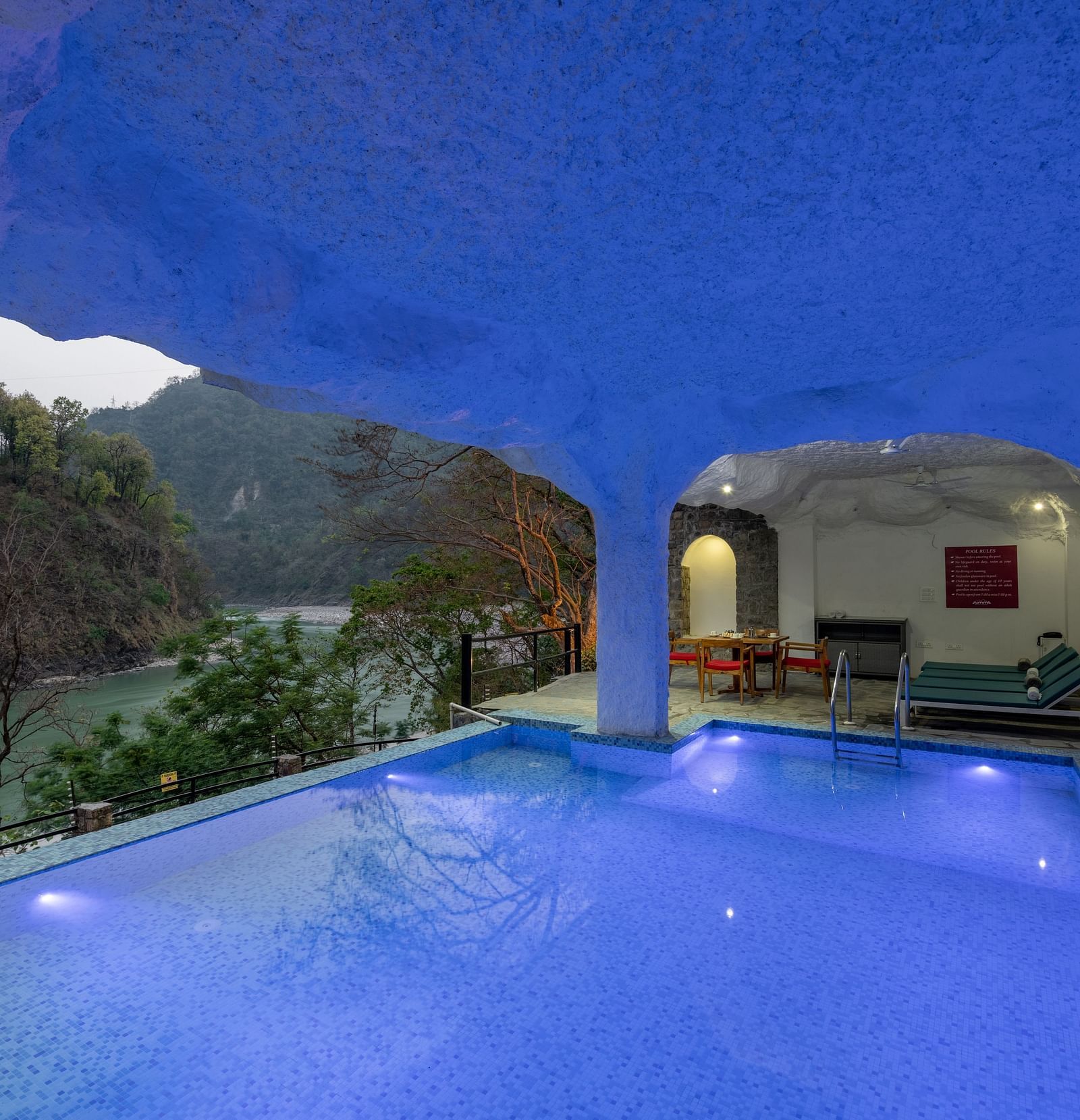Image of a swimming pool with view of the lush plantations at Summit By The Ganges Beach Resort & Spa, Rishikesh