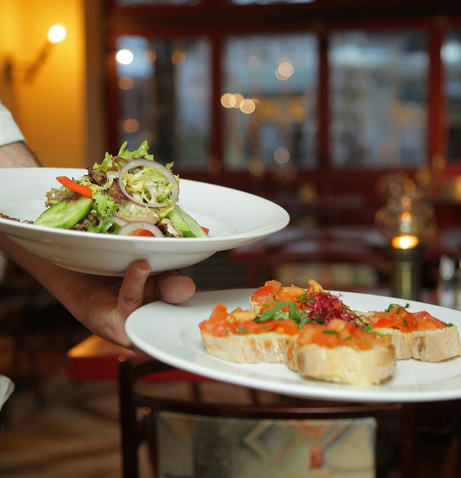 an image of a person serving foods