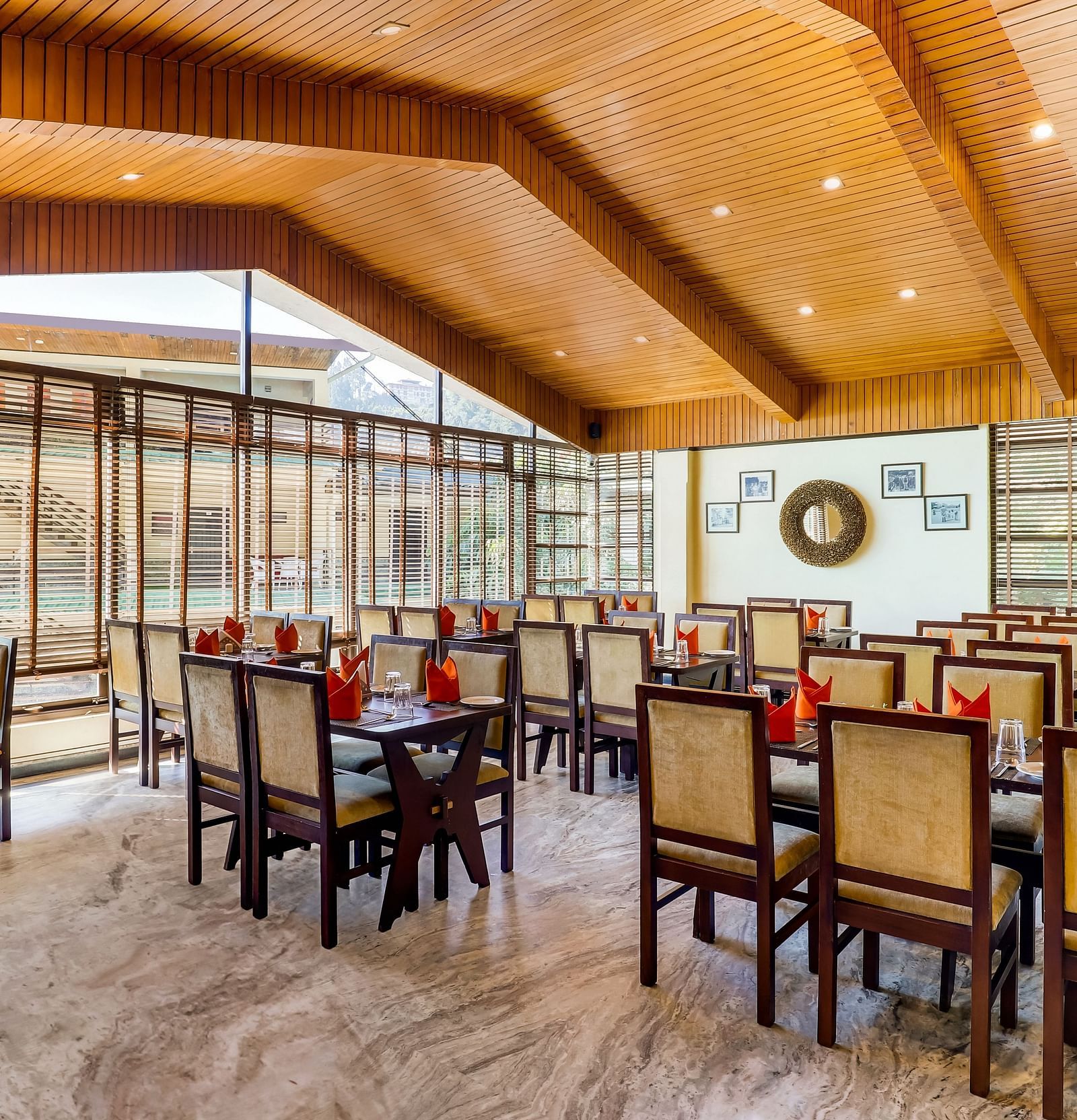 Tsomgo restaurant features cozy lighting, wooden tables and chairs, and culinary arrangements meticulously presented at Summit Norling Resort & Spa, Gangtok1
