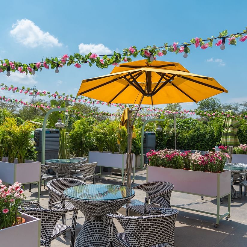 Outdoor seating arrangement at Pizza Bay - Karma Lakelands.