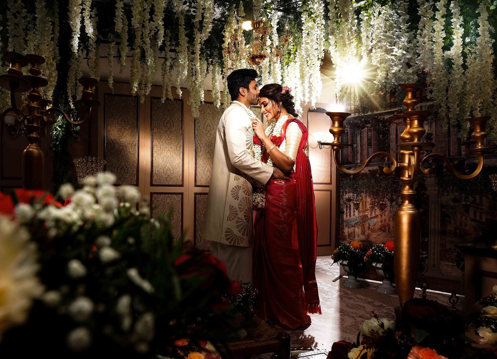 Couple getting married where the groom is kissing the bride's forehead at Grand Chennai By GRT Hotels. - Best Hotel near US Consulate Chennai