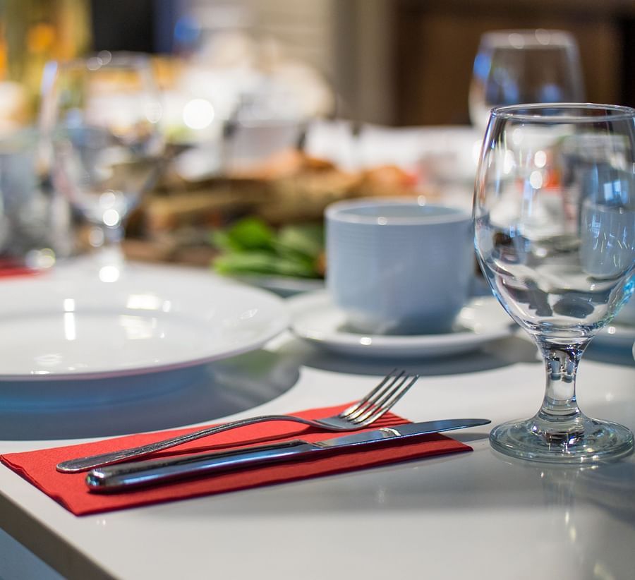 restaurant table with glasses and plates