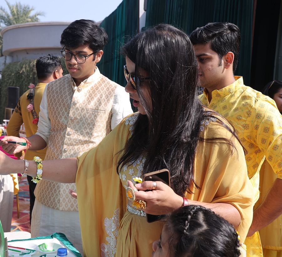 alt-text Guests participating in a lively wedding activity at Shri Radha Brij Vasundhara Resort & Spa.