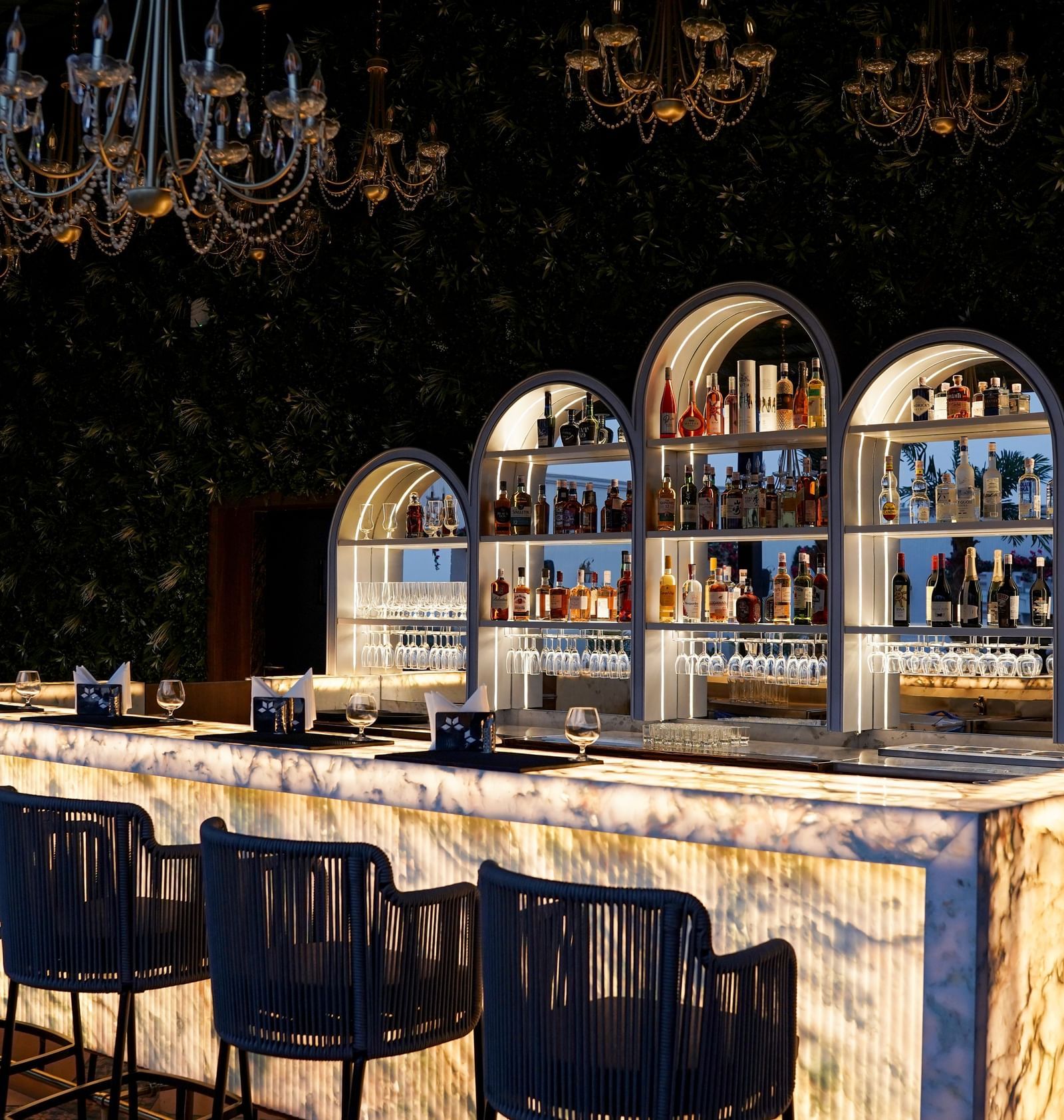 Corner view shot of the bar counter featuring an extensive collection of premium liquor for display at the Sky Roof at M2 Square by Monday Premium.
