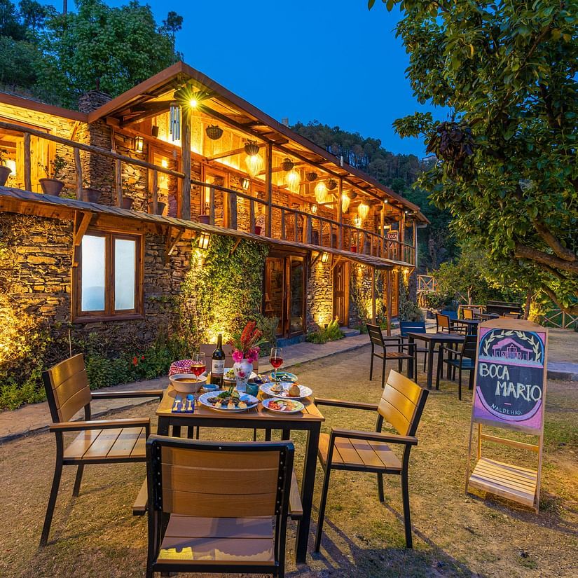 A facade image of the Boca Mario illuminated with bright lights - The Manor Luxury Hotel, Shimla