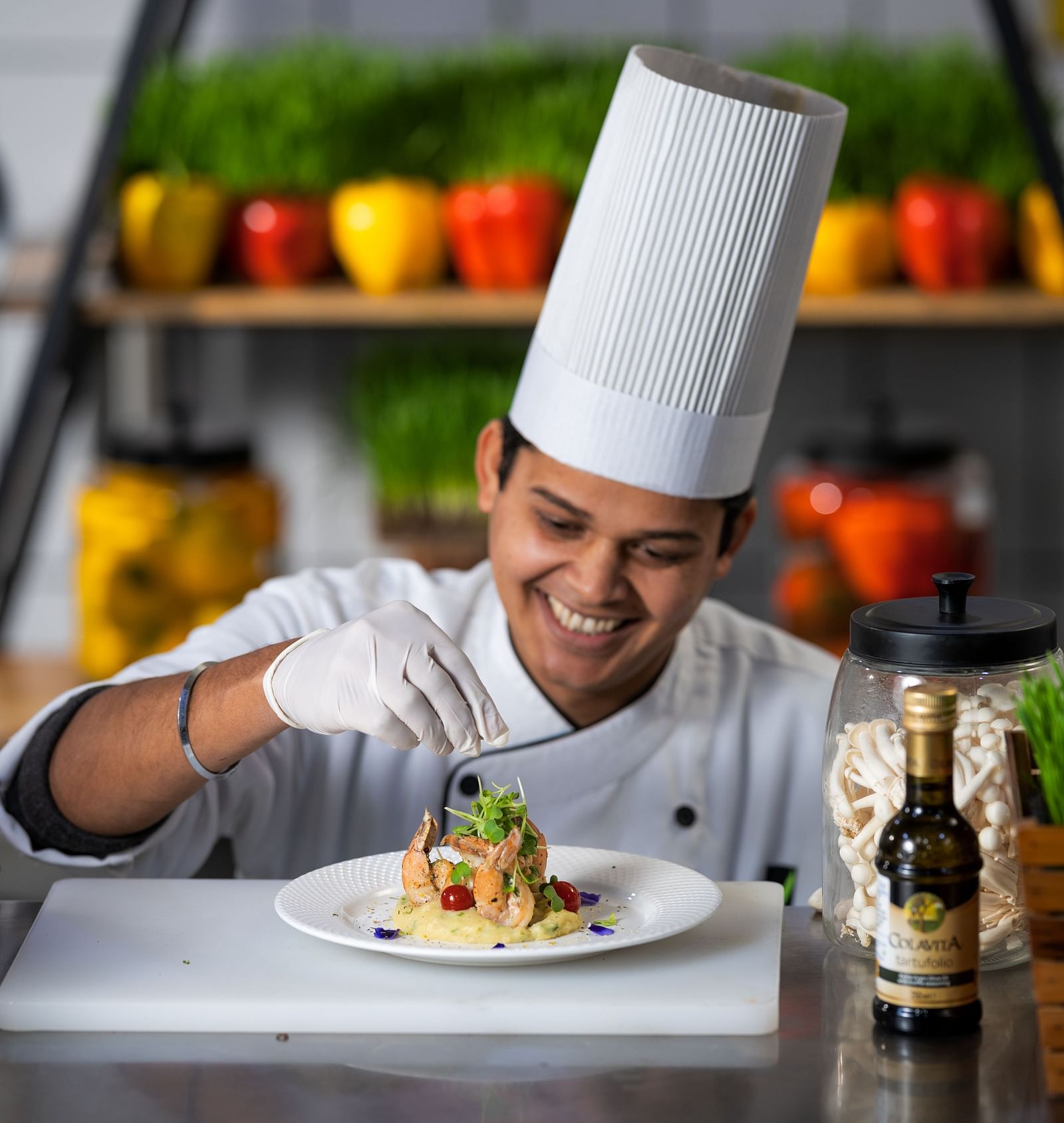  A chef garnishing a dish at Nirvana Luxury Hotel, Ludhiana.