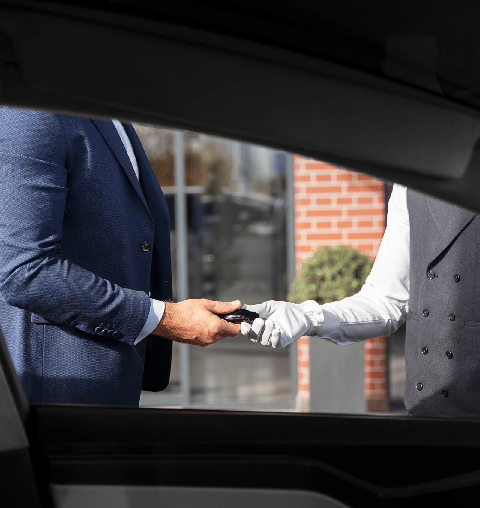 men-holding-car-key-side-view