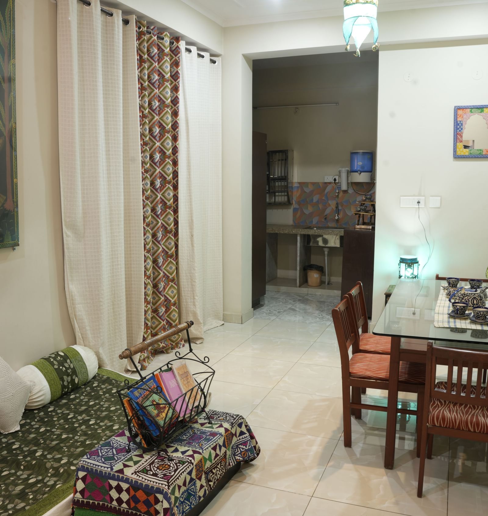 Rooftop terrace with numerous potted plants arranged along the edges of the open space at Jaypore360 Homestay in Jaipur.