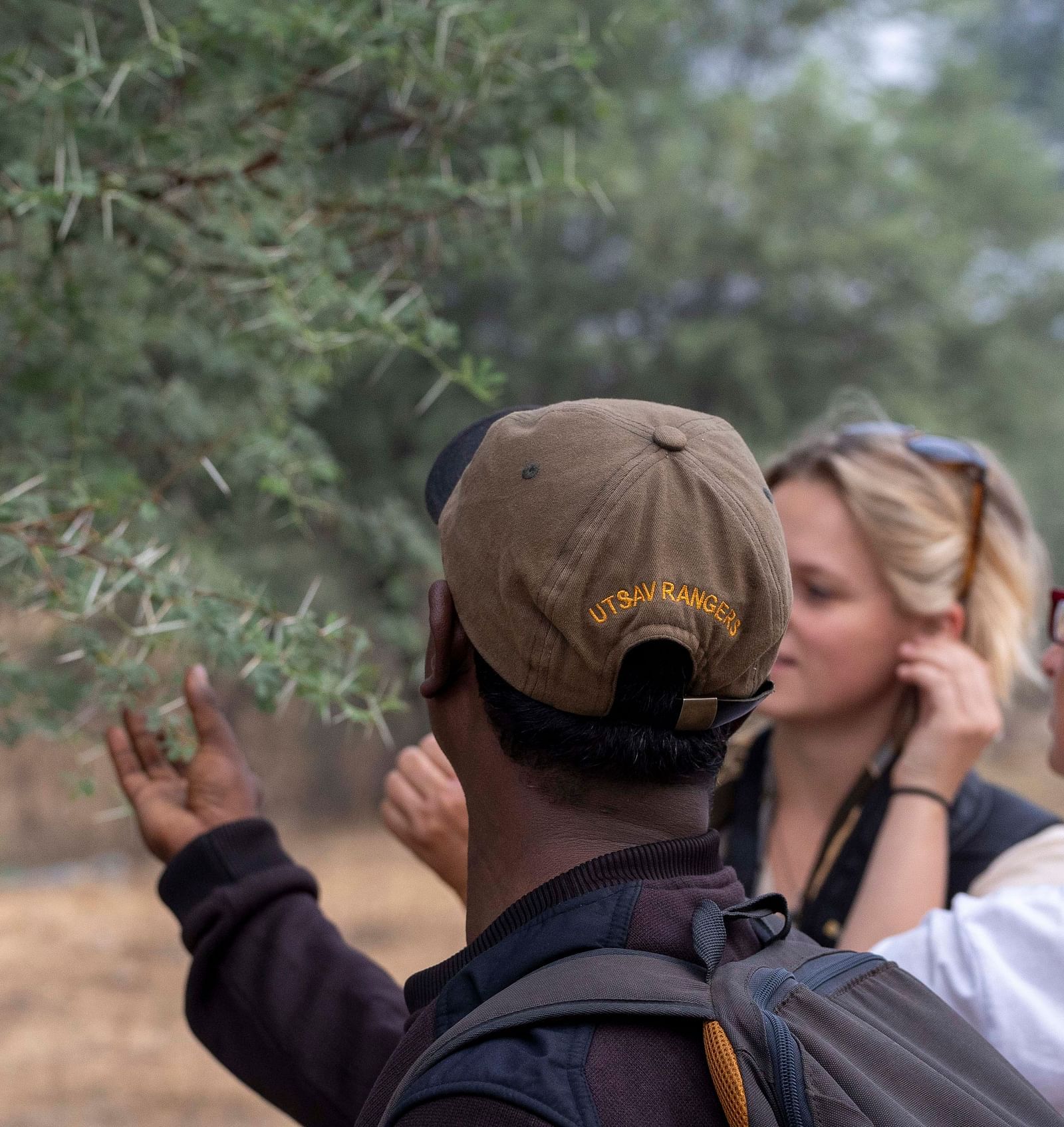 An image of two women with a tourist guide - Utsav Camp Sariska