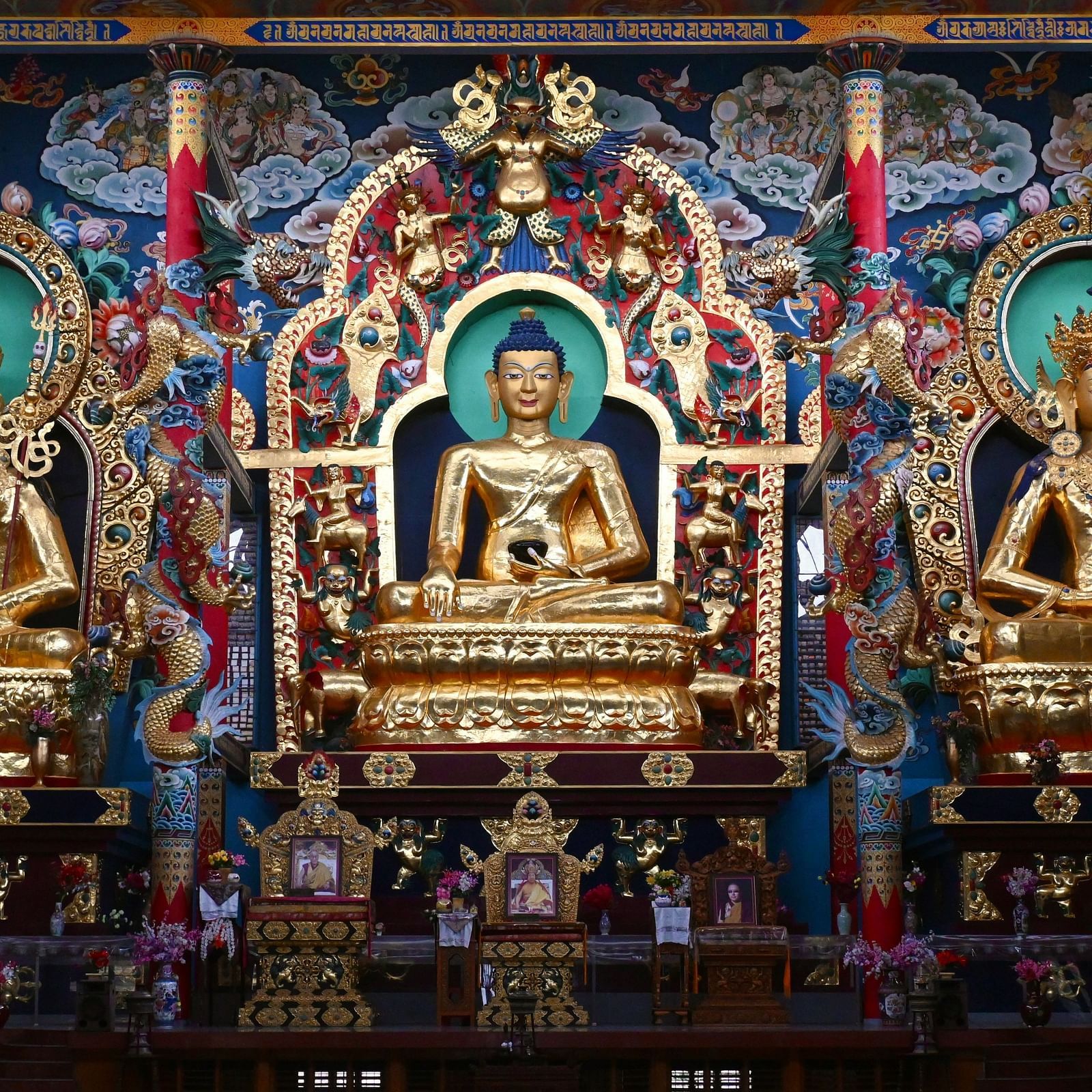 Ornate display of Buddhist-style idols near Coorg Jungle Camp Backwater Resort, highlighting cultural richness in Kushalnagar.