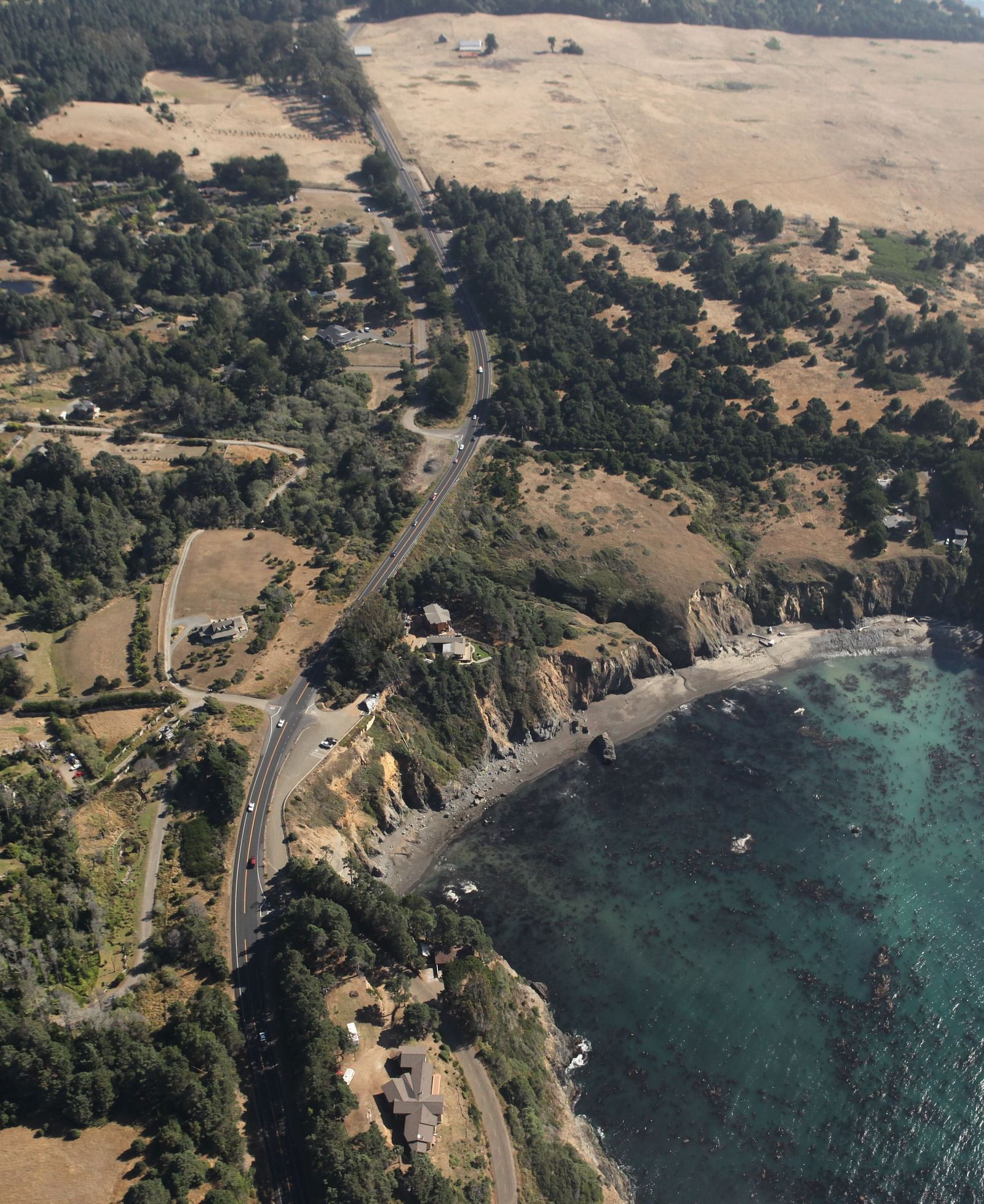 Ariel view of a highway by the coast of Mendocino Bay - Brewery Gulch Inn & Spa