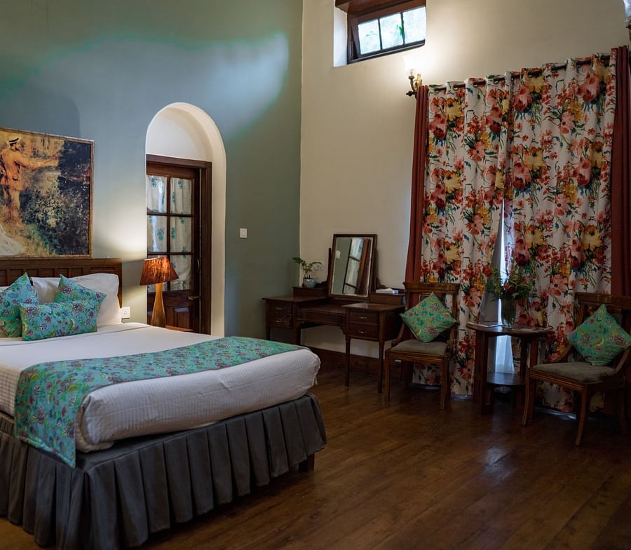 room with a king size bed and chairs at king's cliff
