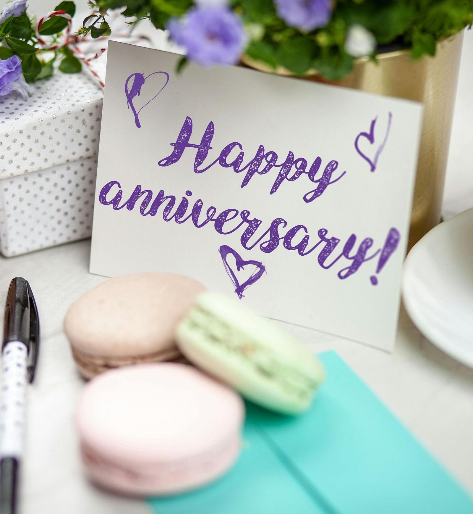 Happy anniversary card with coffee and macarons on a decorated table | Mango HIll Central, Ooty
