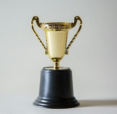 A gleaming golden trophy, symbolizing excellence and achievement