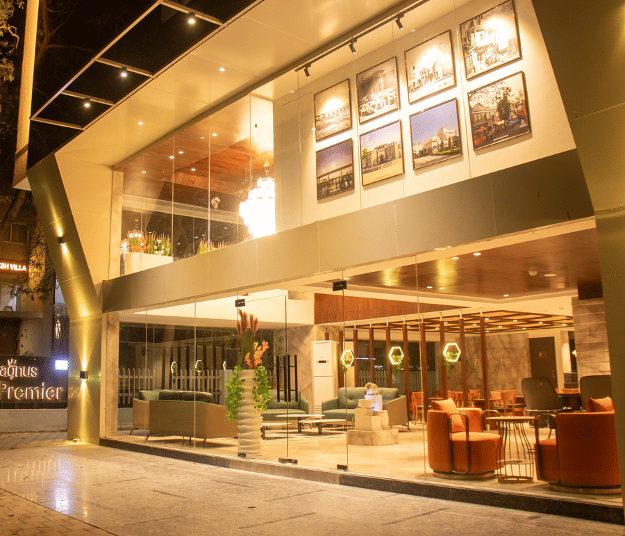 The exterior of a hotel with lit facade and entrance area at Magnus Lxia Premier, Kalyani Nagar.