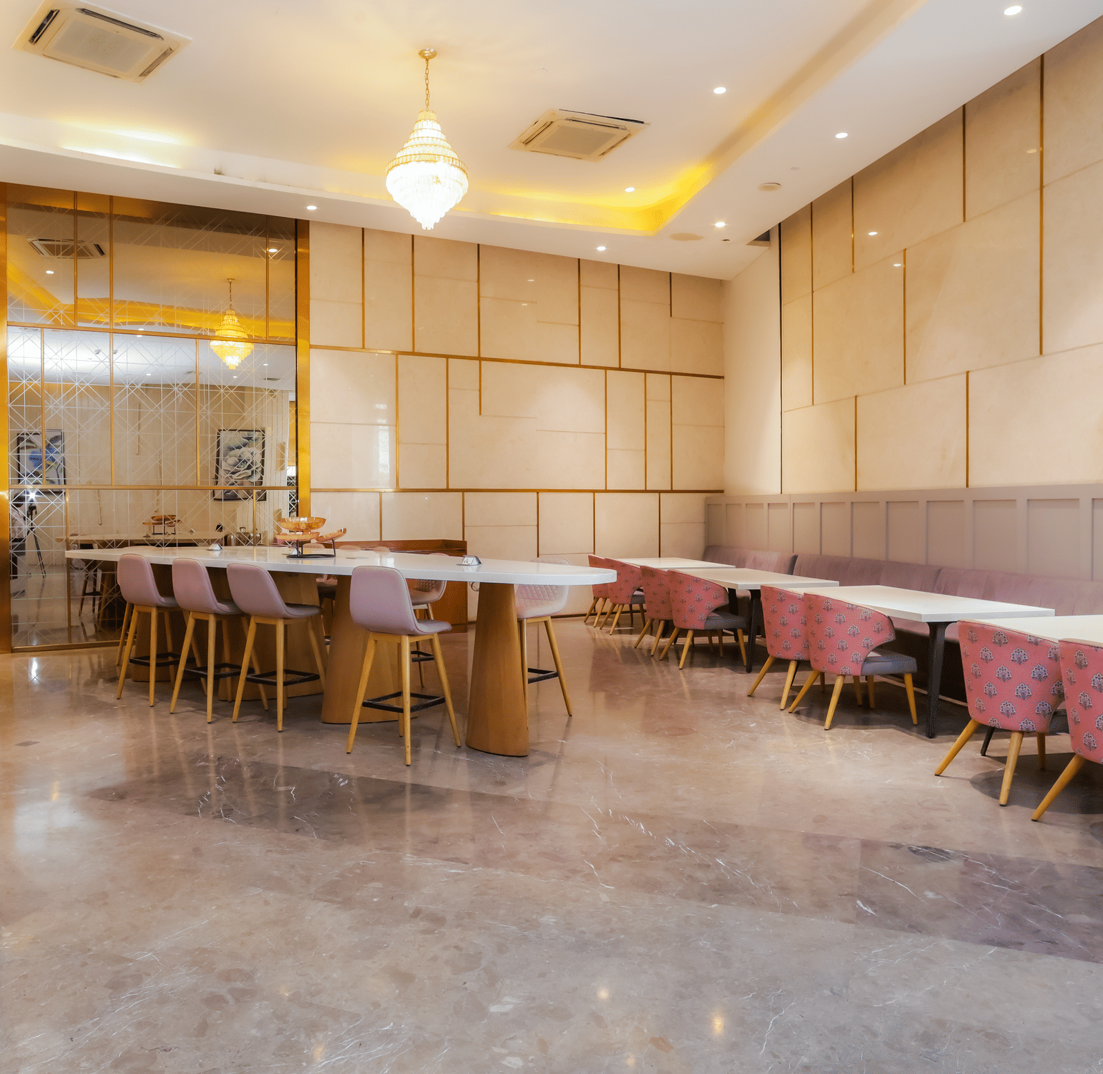 Spacious restaurant seating at Livbox Supernova, featuring contemporary interiors with comfortable chairs and wall art.