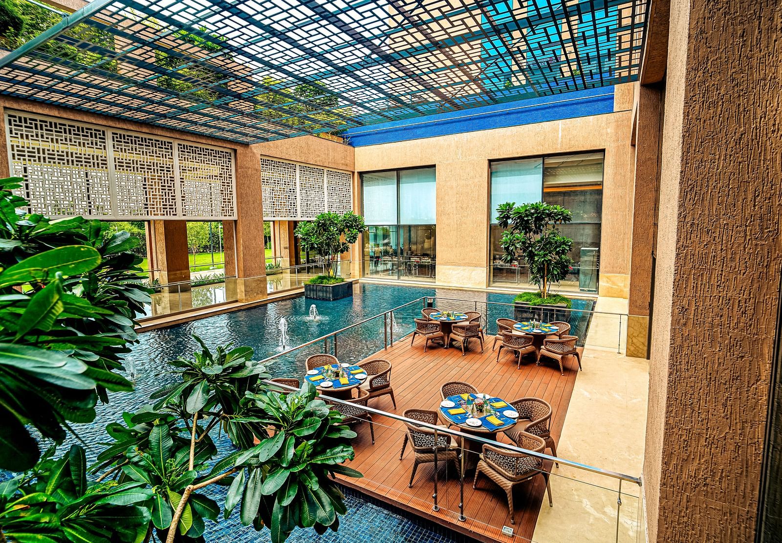 A stunning outdoor dining area with water features and natural light, creating a tranquil dining experience