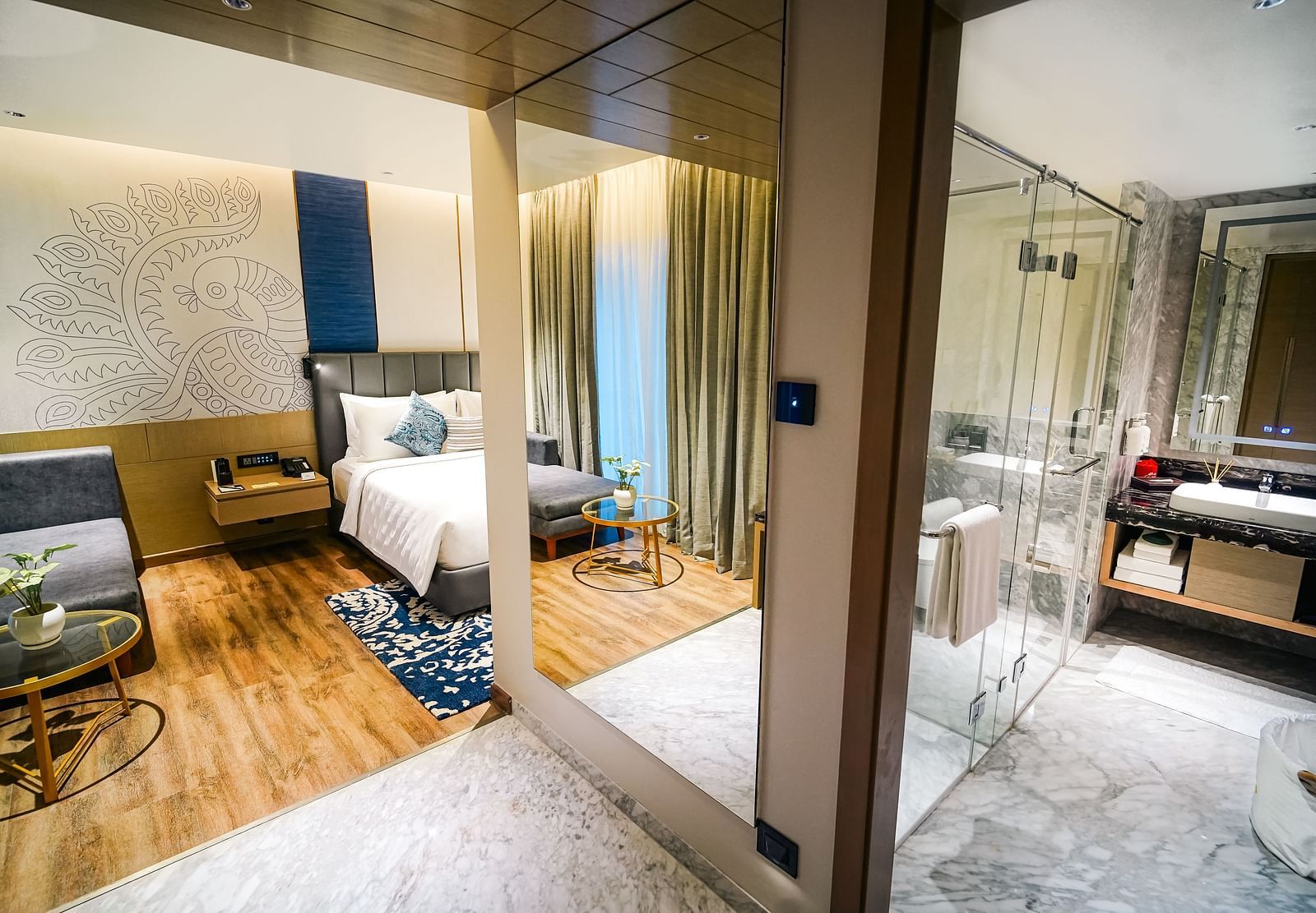 A panorama shot of the Executive Suite with a bedroom on the left and washroom on the right