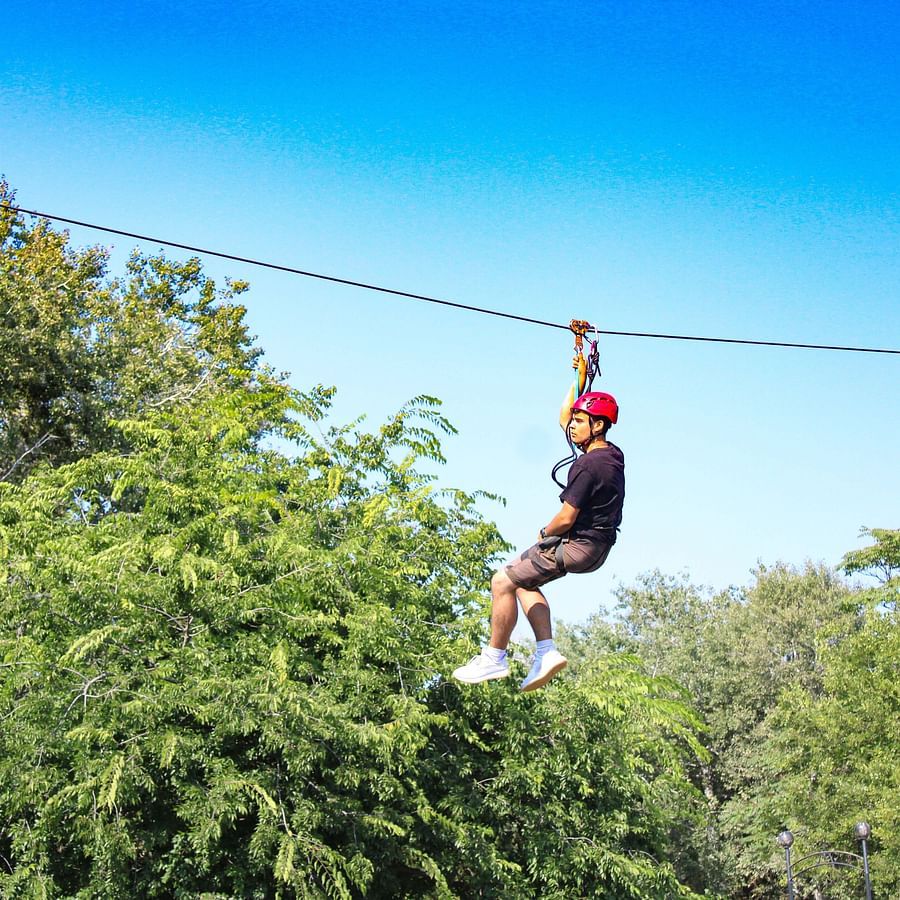 a person ziplining during daytime