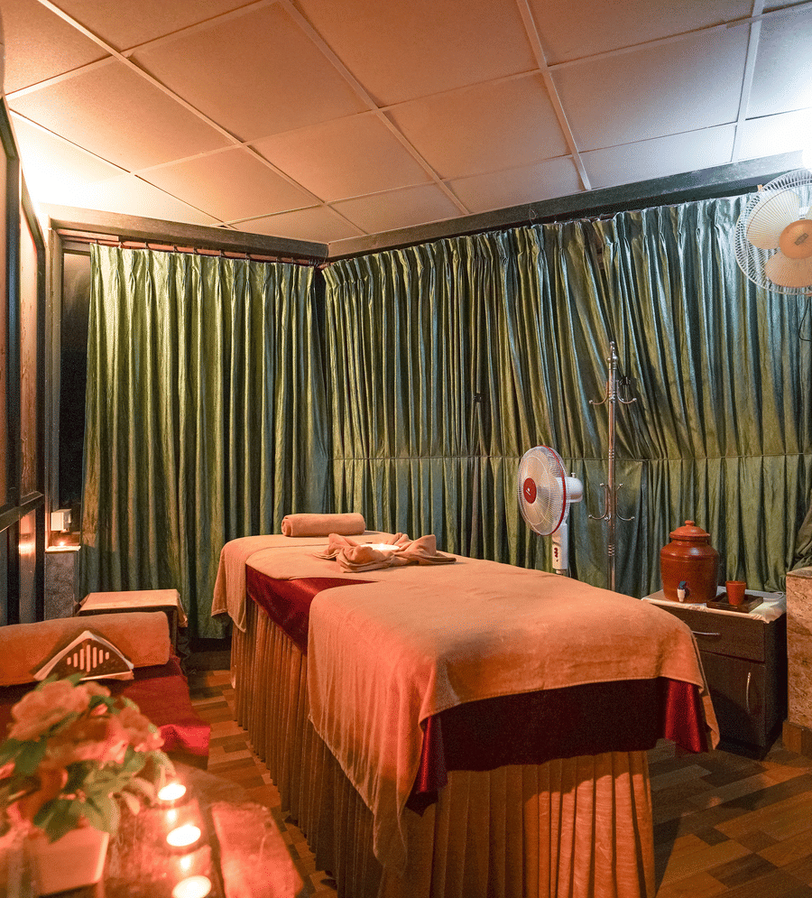 Image of a the spa with a bed at Coorg Jungle Camp Backwater Resort, Kushalnagar.