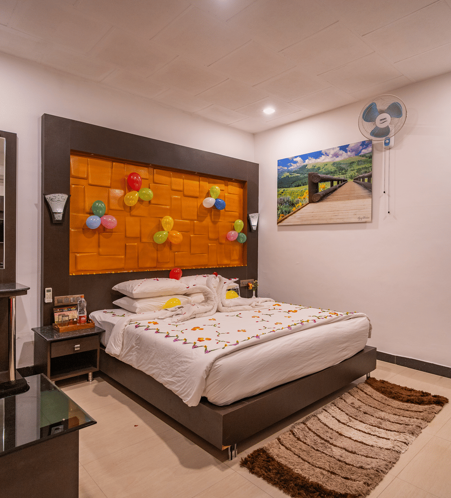 Image of a room with a bed and balloons attached to the headboard at Coorg Jungle Camp Backwater Resort, Kushalnagar.