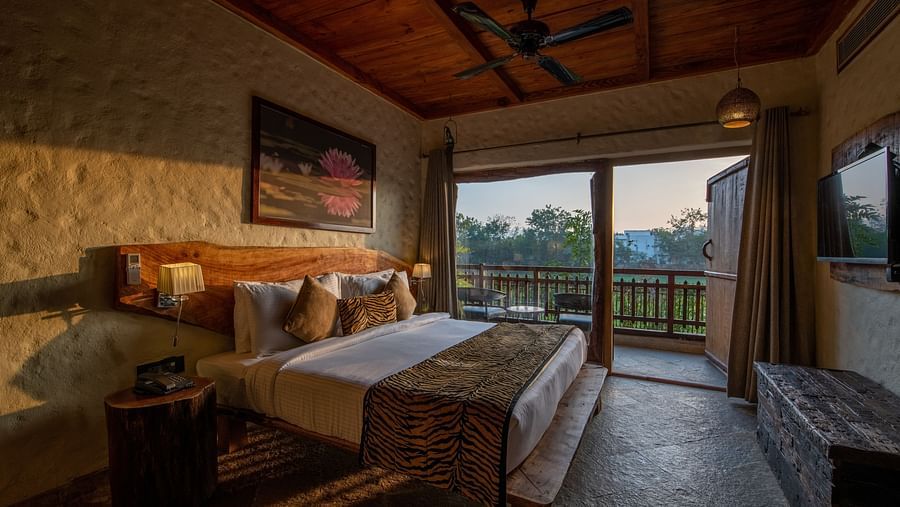 view of the bed beside the balcony offered by one of the rooms in Ranthambore