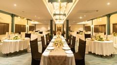 Anchorage - Refined dining room with white clothed tables set for a formal dinner in  Polo Floatel Kolkata