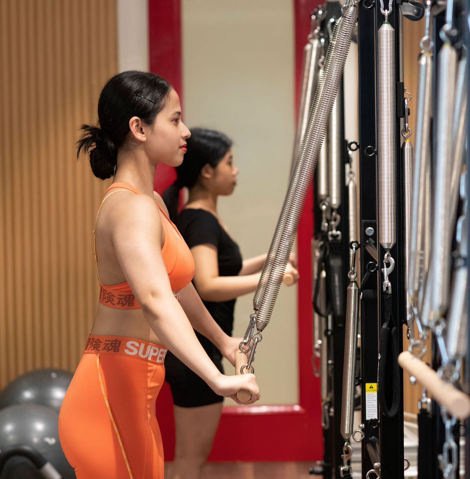 image of two women performing Pilates at the sumaya - The Claridges New Delhi 