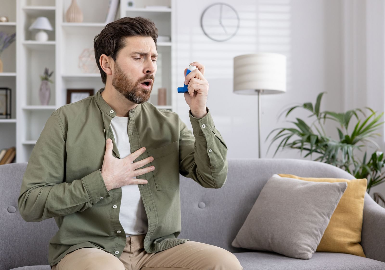 A person experiencing difficulty in breathing trying to use an inhaler - Shreyas Retreat