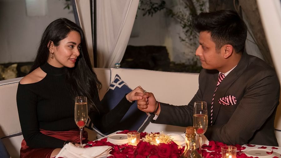 A couple enjoying a romantic dinner at the Sevilla restaurant - The Claridges New Delhi