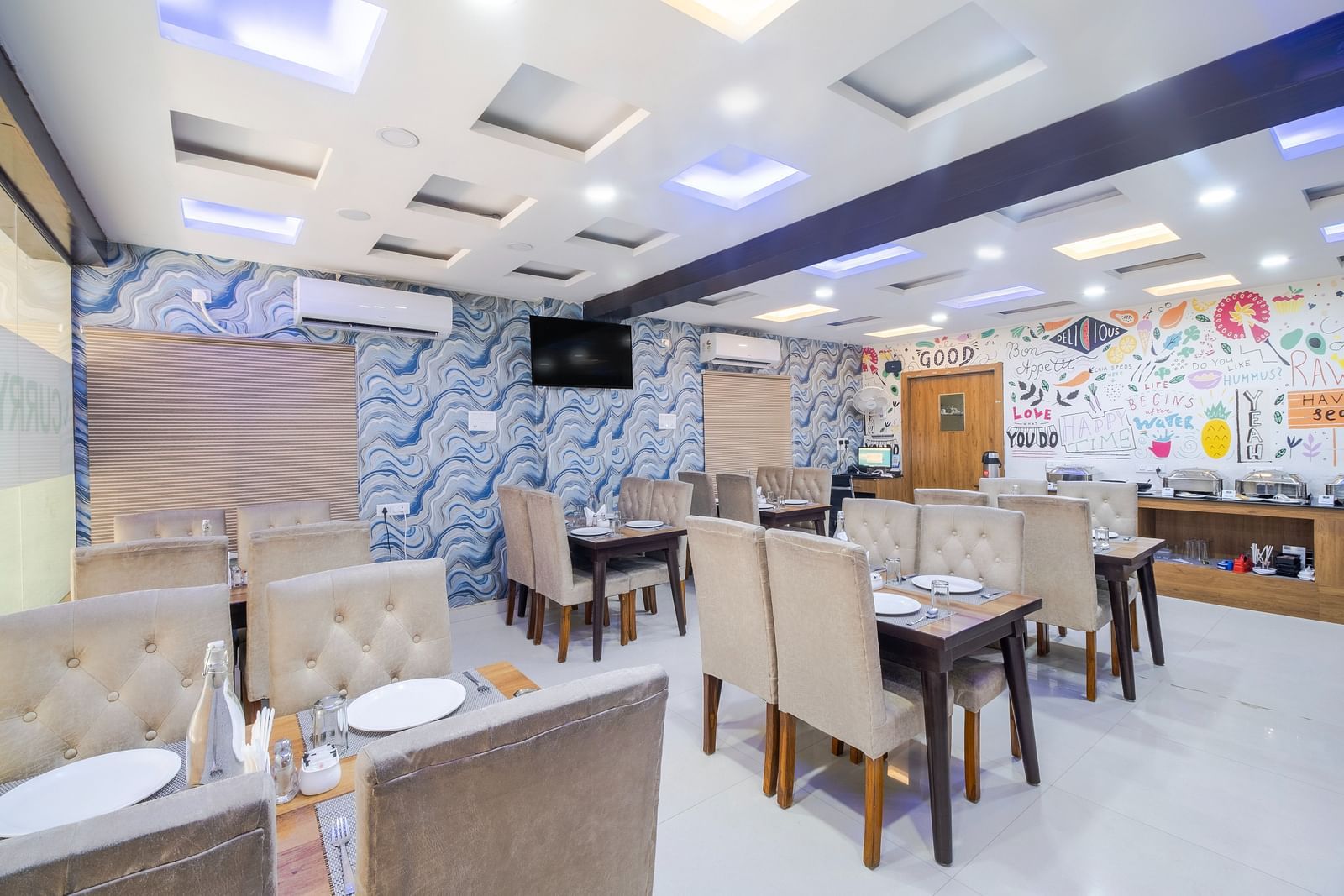 Dining tables arranged in the restaurant at Lemonridge Hotels