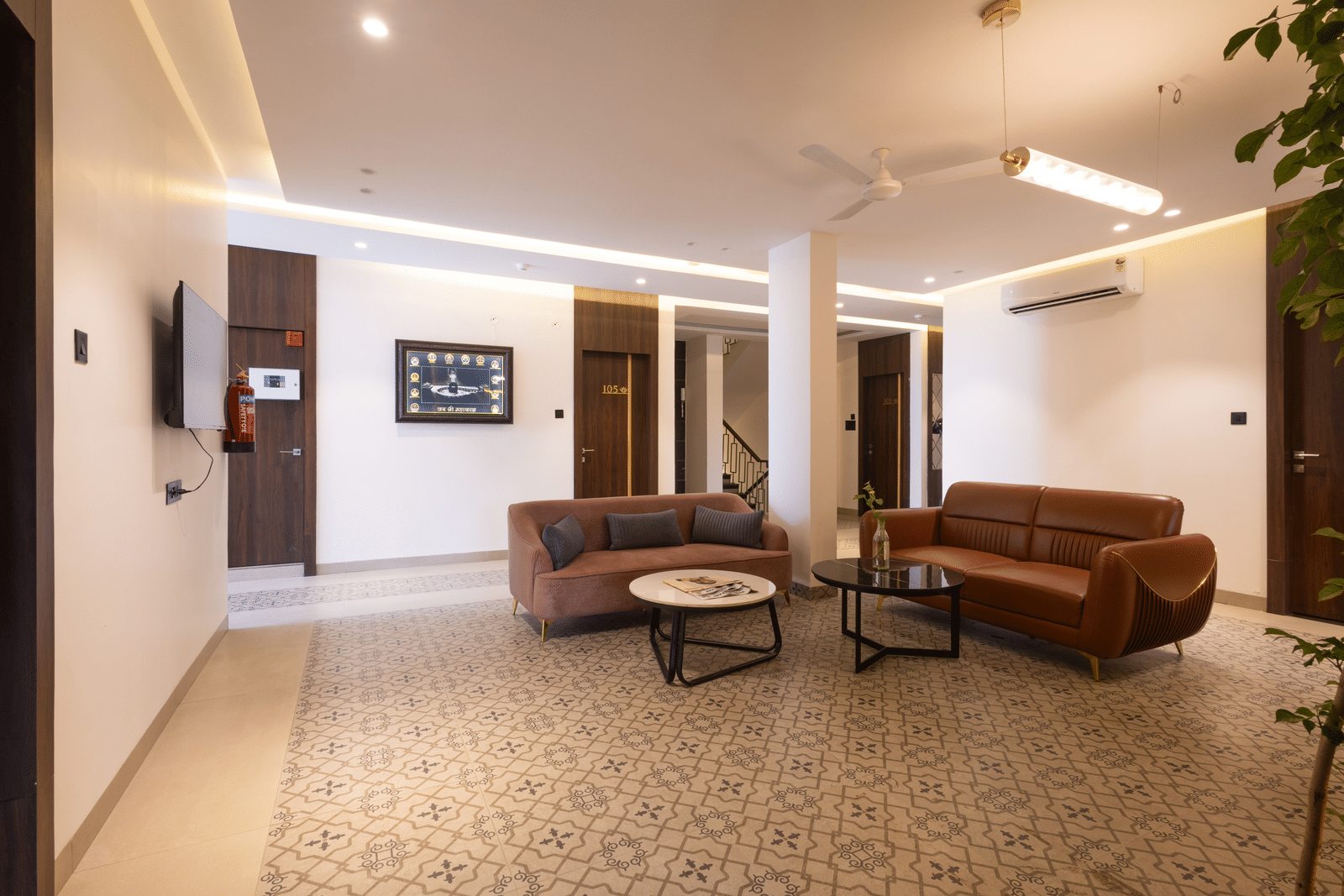 Interior view of the common area/lobby with seating at Pravasa Stay Luv Kush, Indore.