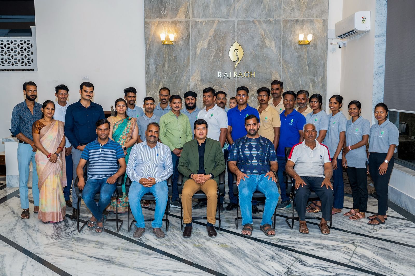 An overview of the wellness team at Rajbagh Wellness posing for a picture together.