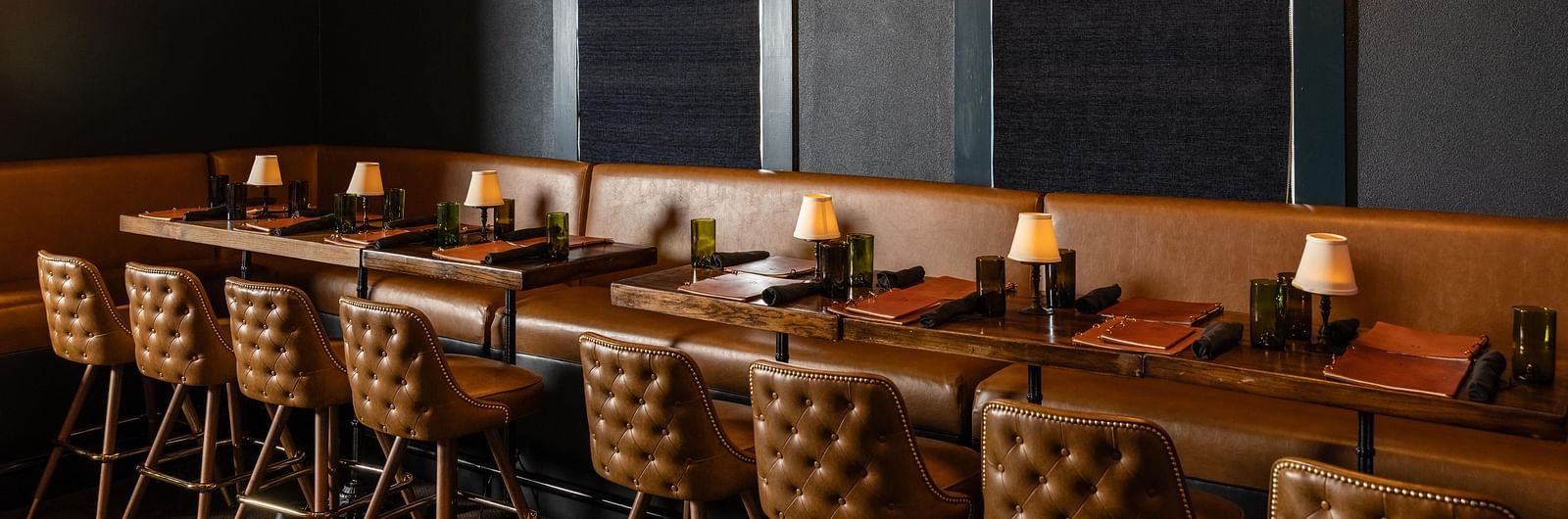 Cozy restaurant seating with pendant lights at The Grand Hotel & Ballroom, McKinney.