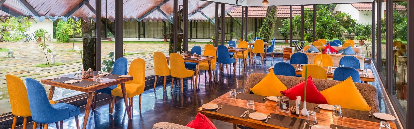 image featuring the full view of Kalptaru with nicely arranged chairs and tables for a multi-cuisne dining experience at aranya vilas in udaipur 