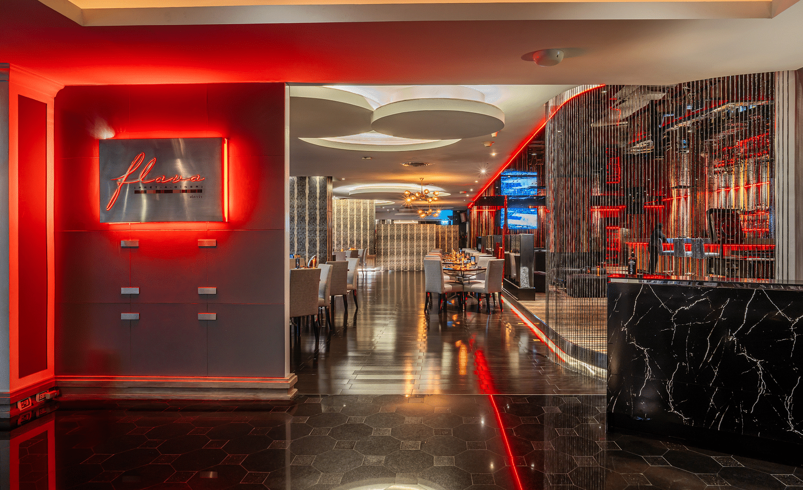 Entrance view of Flava Lite with chairs in the background - Night Hotel Bangkok.