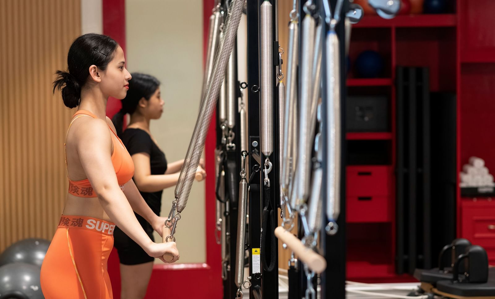 image of two women performing Pilates at the sumaya - The Claridges New Delhi 