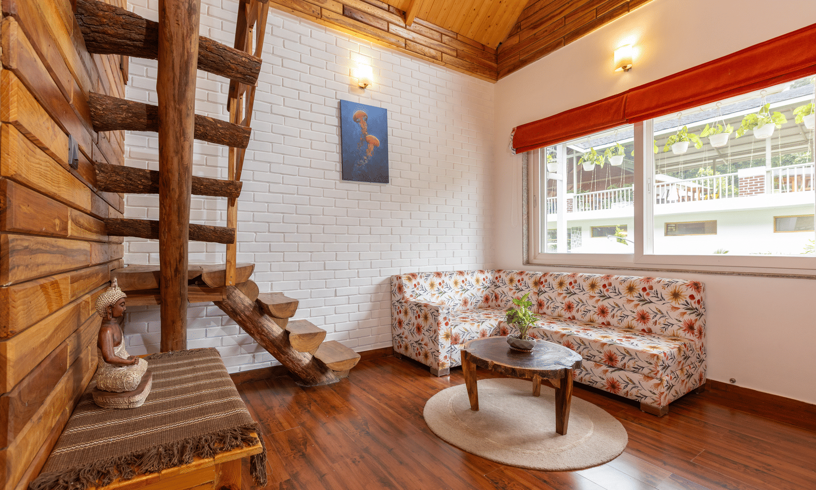 A cosy living space with wooden walls, flooring, a sofa, and an open-tread staircase - Megha Resort & Villas, Dehradun