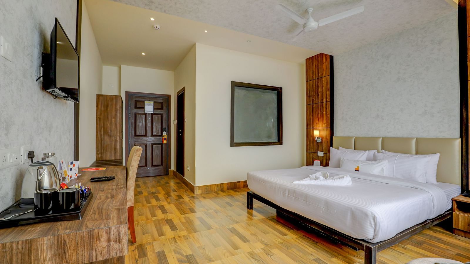 view of king size bed and TV of a Deluxe Room Banari Regency by Summit, Namchi