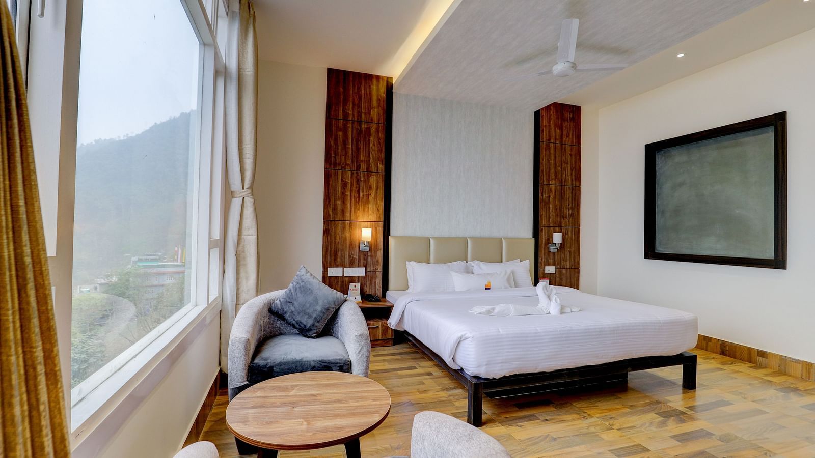 view of king size bed and TV of a Deluxe Room Banari Regency by Summit, Namchi