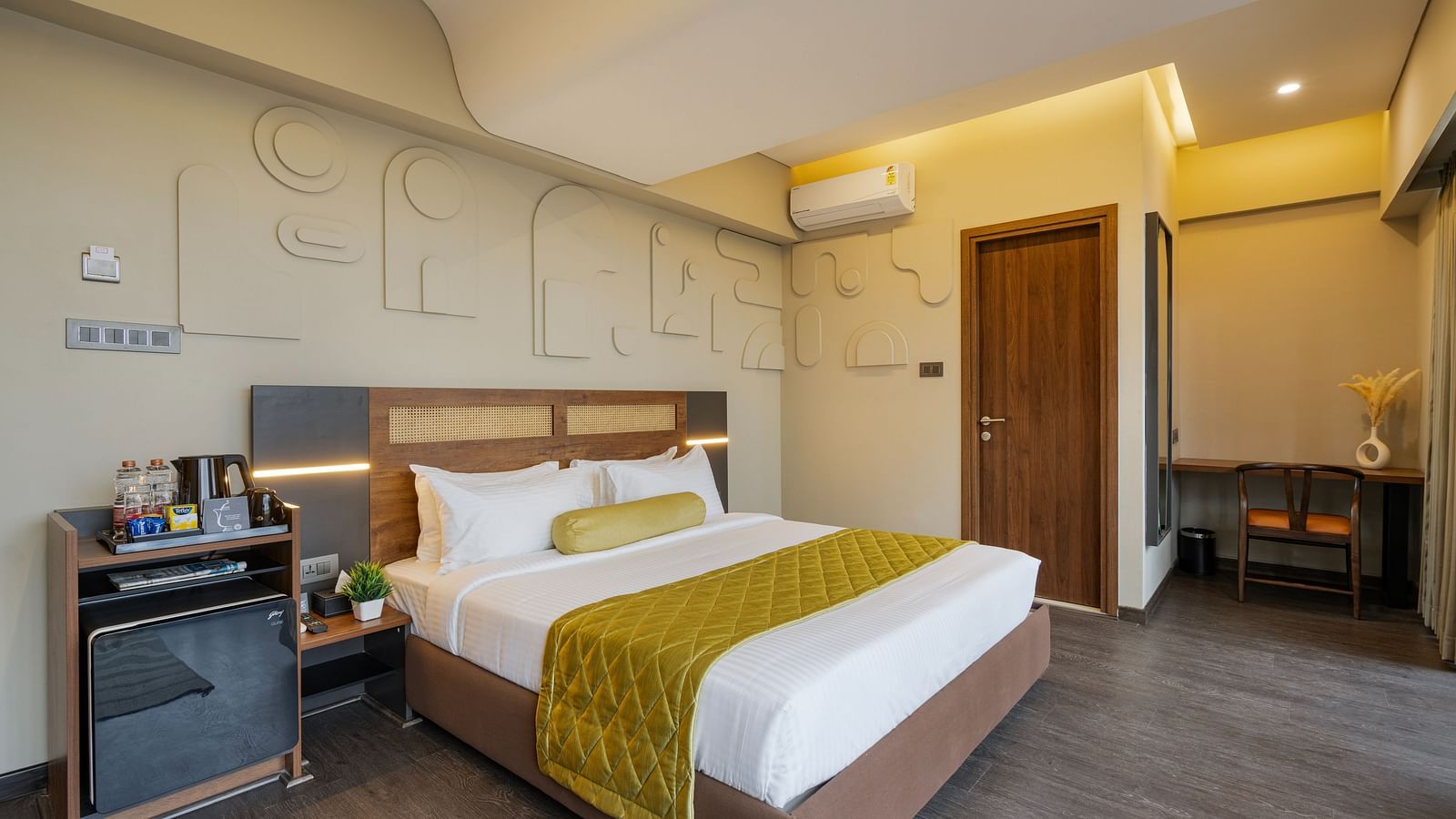 Citrus Room at Fressotel, Kanakapura Road, with a 240 sq. ft. space, air-conditioning, and a 40-inch Android TV.