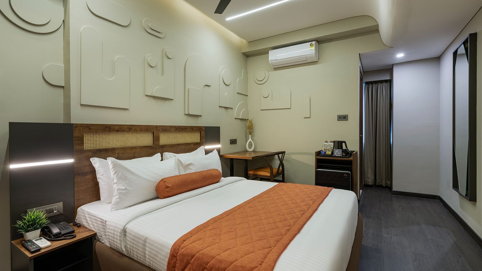 Elegant Tangerine Room offering modern amenities in a tranquil setting at Fressotel, Kanakapura Road.