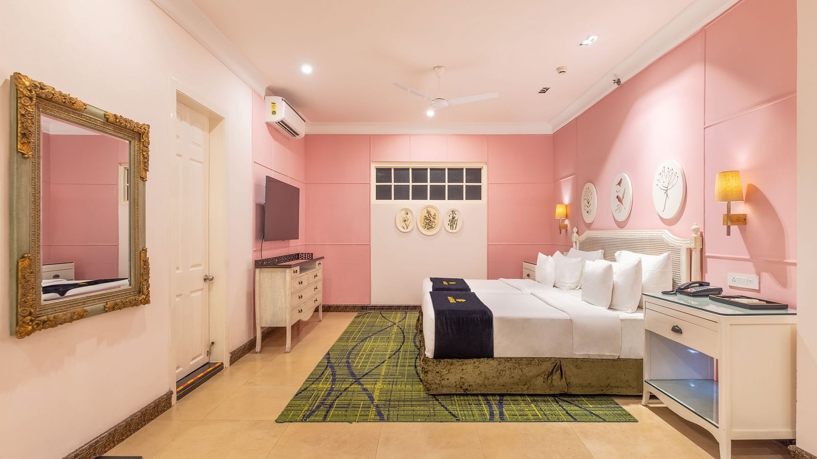 Pastel pink vanity and dressing space with ornate mirror at MAYFAIR Palm Beach Resort, Gopalpur-on-Sea