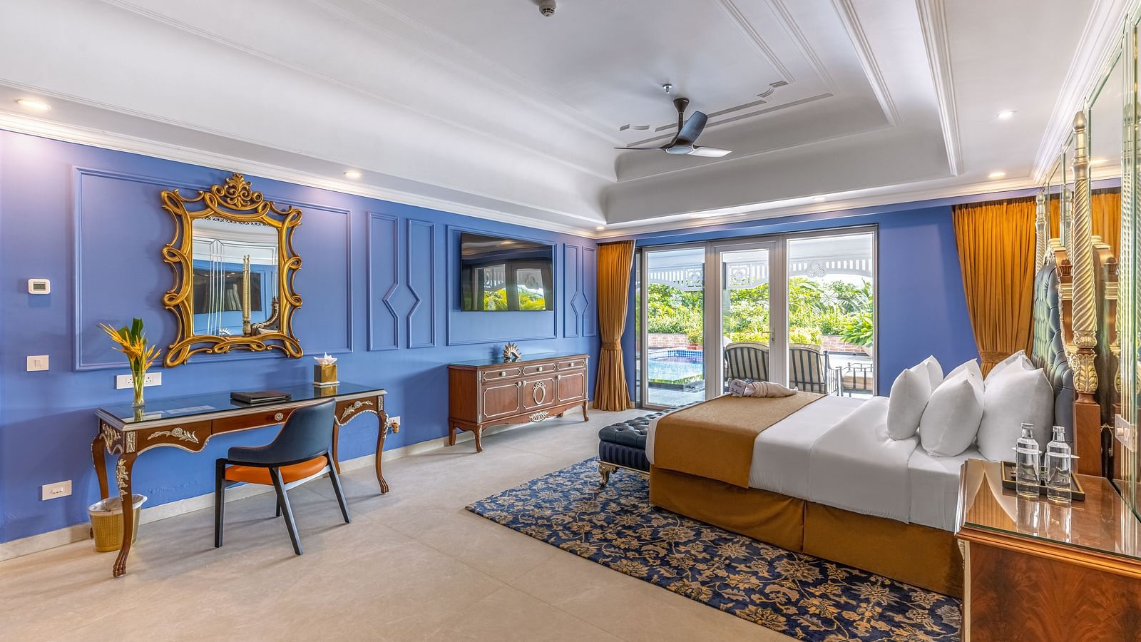 Elegant suite with blue and white interiors and traditional decor at MAYFAIR Palm Beach Resort, Gopalpur-on-Sea