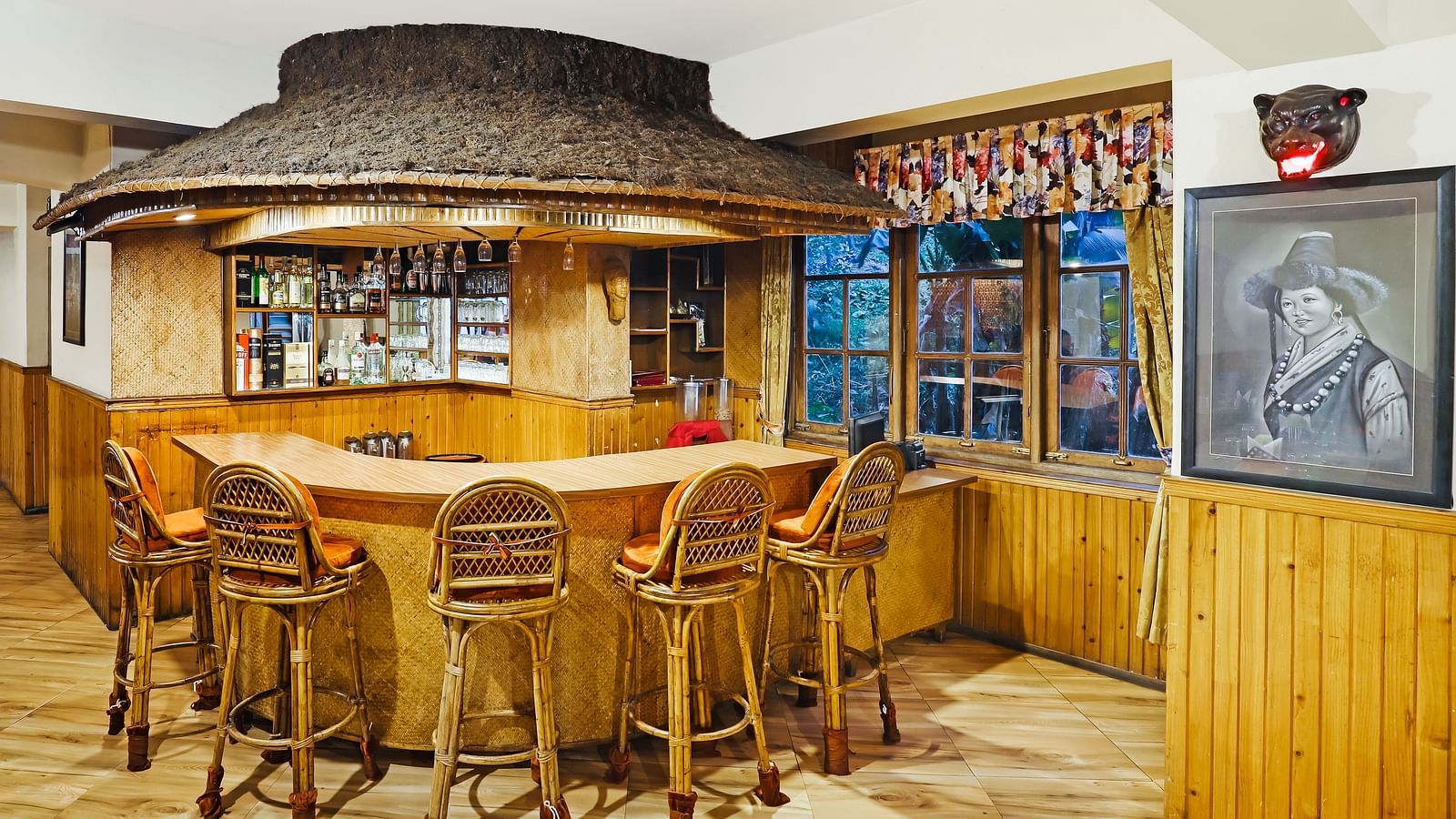 Chairs placed near a bar | Summit Newa Regency & Spa, Pelling